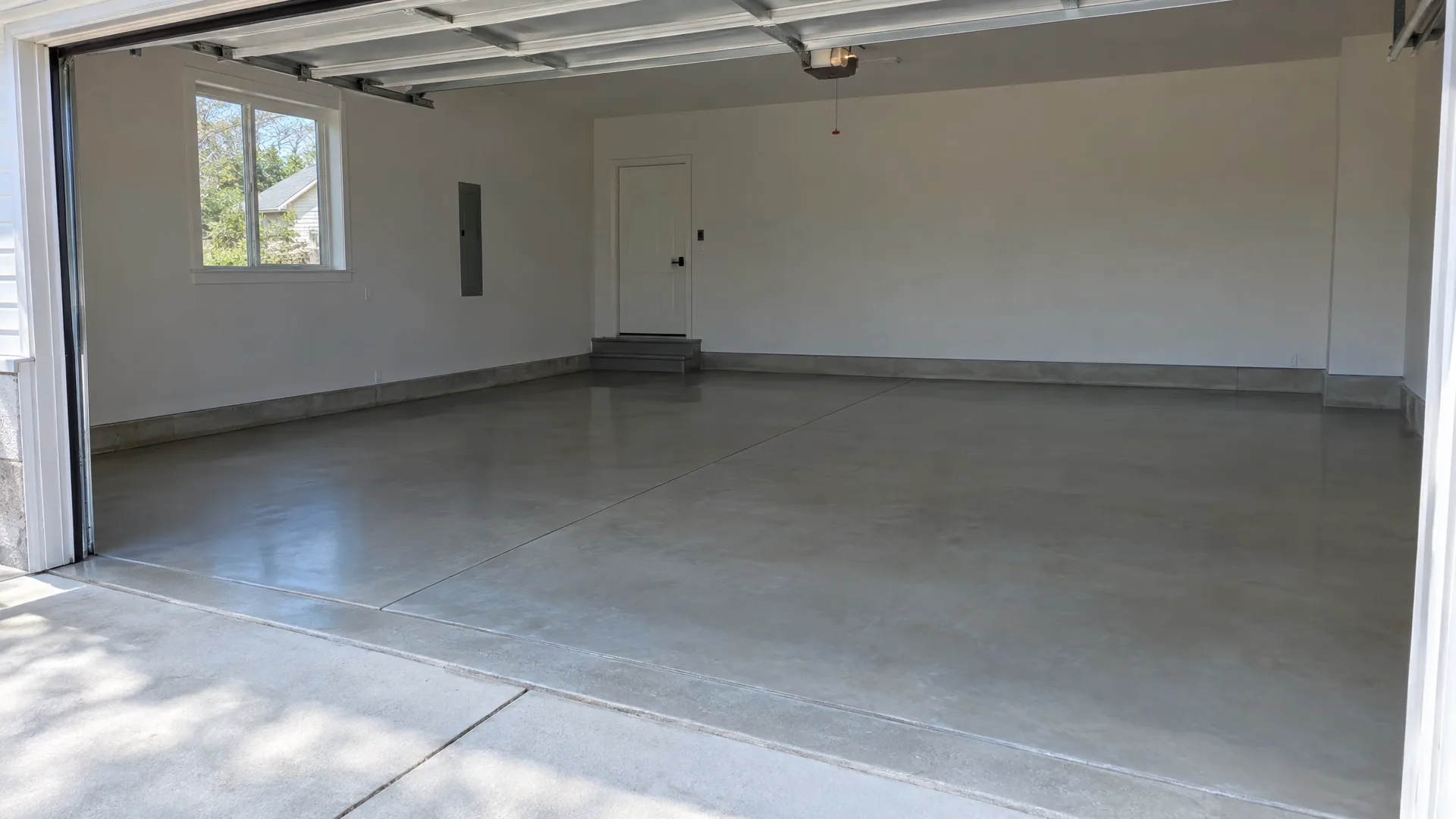 Clean concrete floor in an empty two-car garage